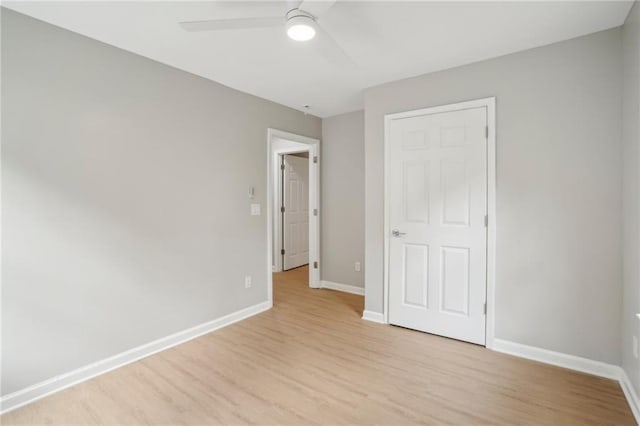 789 Third St, Stone Mountain, GA 30083 - unfurnished bedroom with light wood-type flooring, baseboards, and a ceiling fan