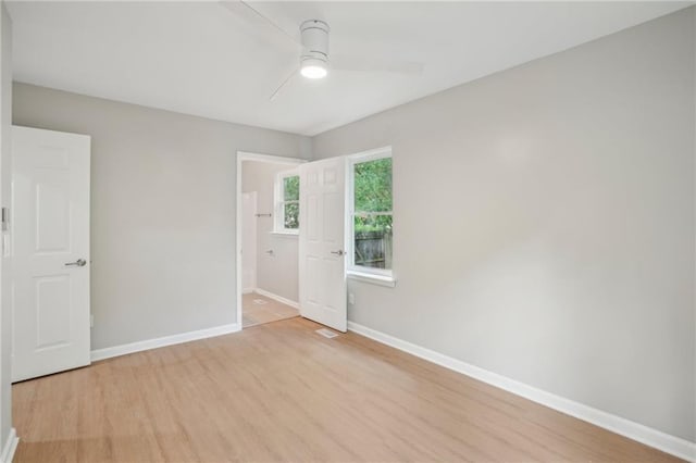 789 Third St, Stone Mountain, GA 30083 - empty room with ceiling fan, light wood finished floors, and baseboards
