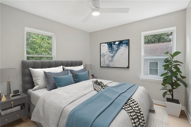 789 Third St, Stone Mountain, GA 30083 - bedroom with multiple windows, a ceiling fan, baseboards, and light wood-type flooring