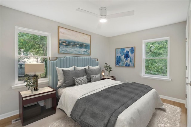 789 Third St, Stone Mountain, GA 30083 - bedroom with baseboards, wood finished floors, and a ceiling fan