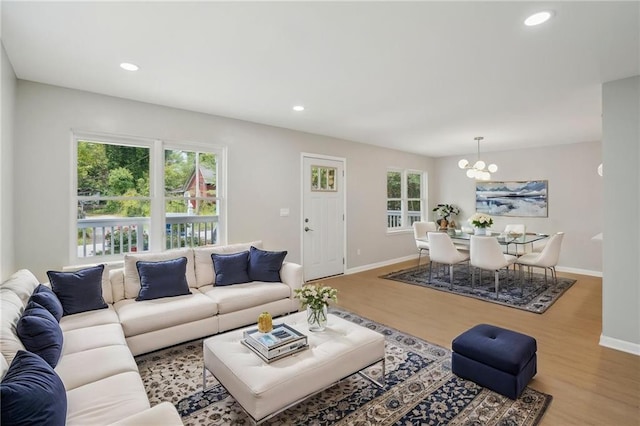 789 Third St, Stone Mountain, GA 30083 - living area featuring a chandelier, wood finished floors, baseboards, and recessed lighting