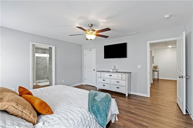 bedroom with attic access, dark wood-style floors, ceiling fan, and baseboards