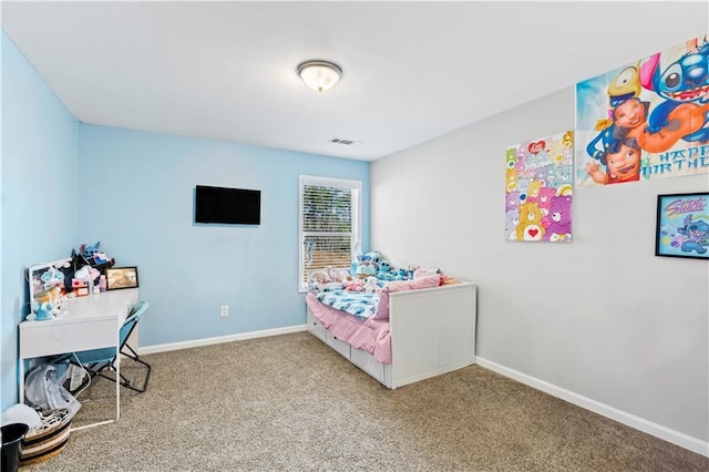 carpeted bedroom featuring baseboards and visible vents