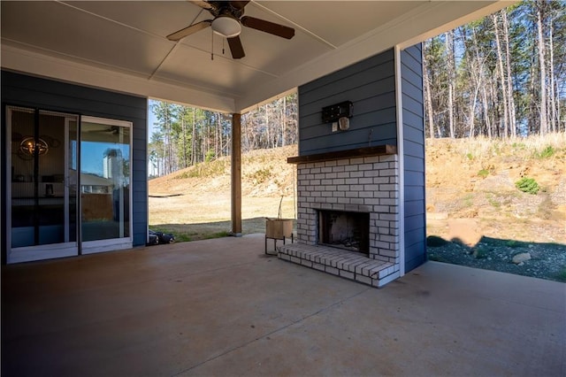 view of patio with an outdoor brick fireplace and a ceiling fan