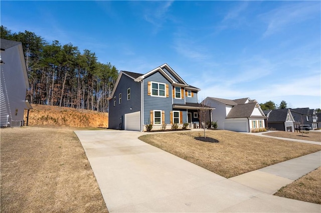 view of front of home featuring a front yard, a porch, a garage, and concrete driveway