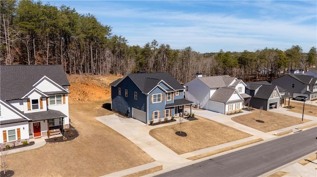 aerial view with a residential view and a wooded view