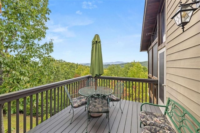 deck with outdoor dining area