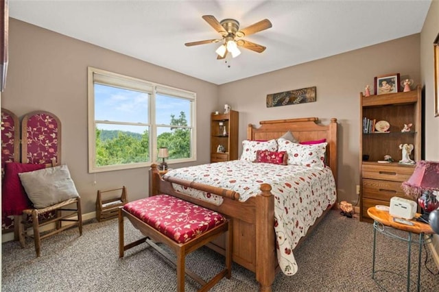 bedroom featuring baseboards, a ceiling fan, and carpet floors