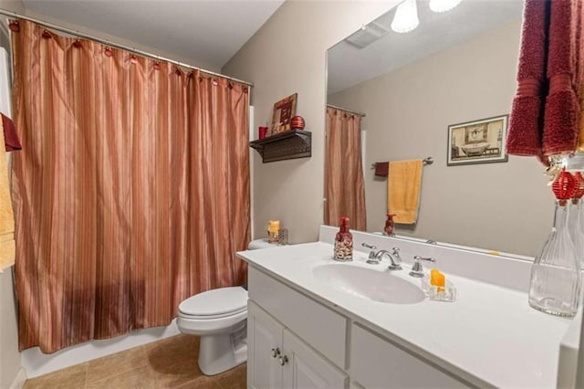 bathroom featuring a shower with curtain, vanity, toilet, visible vents, and tile patterned flooring