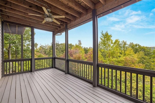 wooden deck with a ceiling fan