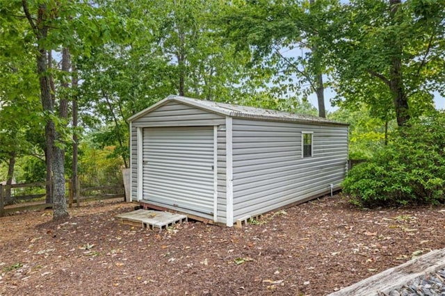 view of shed with fence