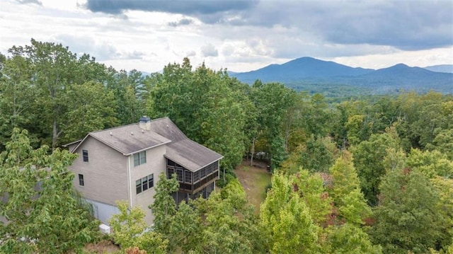 bird's eye view featuring a mountain view and a view of trees