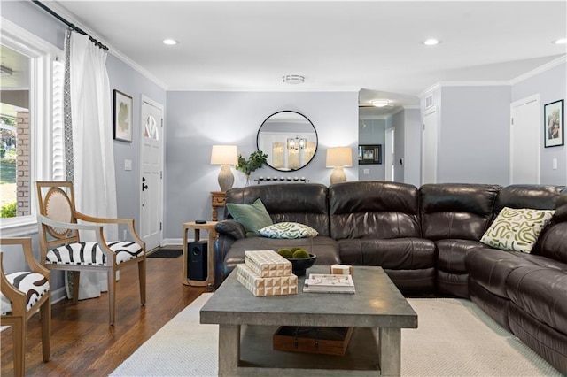 living room with dark hardwood / wood-style floors and crown molding