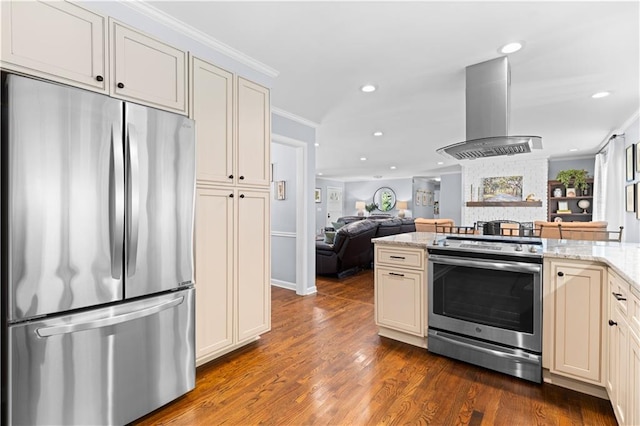 kitchen with dark wood-type flooring, light stone counters, ornamental molding, ventilation hood, and appliances with stainless steel finishes