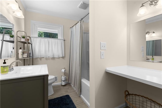 full bathroom featuring shower / tub combo, wood-type flooring, vanity, crown molding, and toilet