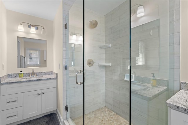 bathroom with vanity and an enclosed shower