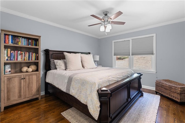 bedroom featuring dark wood-type flooring, ceiling fan, and crown molding