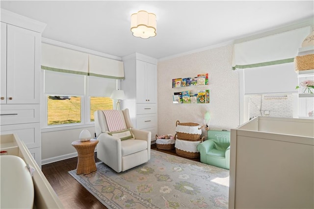 bedroom with a crib, dark wood-type flooring, multiple windows, and crown molding