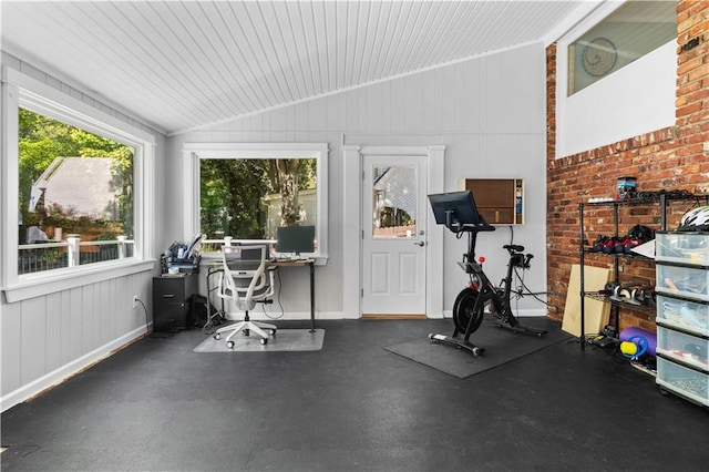 exercise area featuring vaulted ceiling