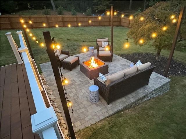 view of patio / terrace with an outdoor living space with a fire pit