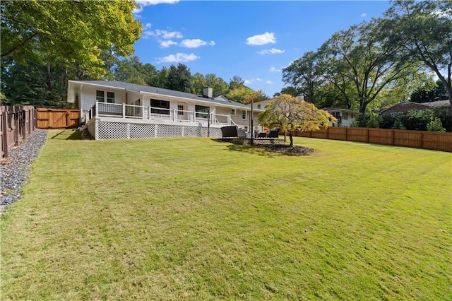 back of property featuring a lawn