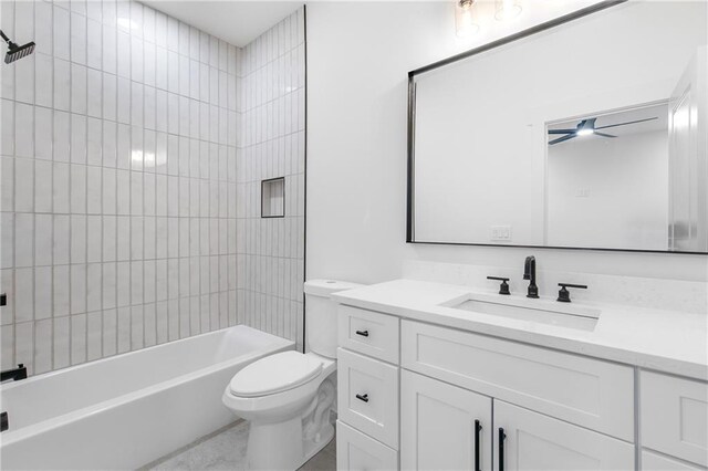 bathroom with shower / washtub combination, vanity, toilet, and a ceiling fan