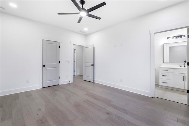 unfurnished bedroom featuring recessed lighting, visible vents, light wood-style flooring, and baseboards