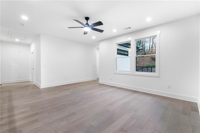 spare room featuring ceiling fan, recessed lighting, attic access, and light wood-style floors