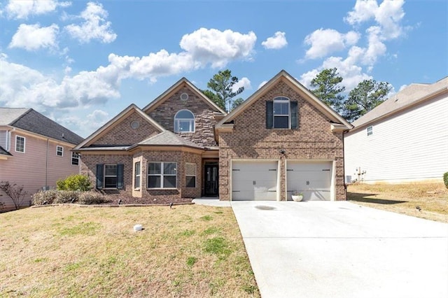 traditional-style house featuring driveway, brick siding, a front lawn, and an attached garage