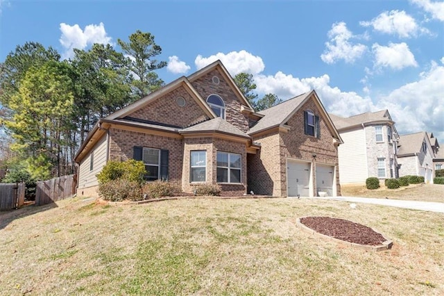 traditional home with driveway, a garage, brick siding, fence, and a front yard