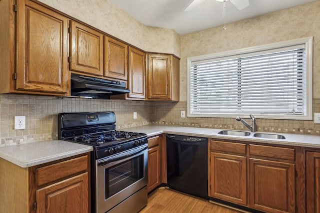 kitchen with sink, light hardwood / wood-style flooring, dishwasher, stainless steel gas stove, and extractor fan