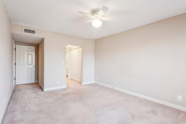 unfurnished bedroom featuring light carpet and ceiling fan