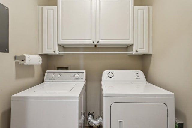 laundry area with cabinets and washer and dryer