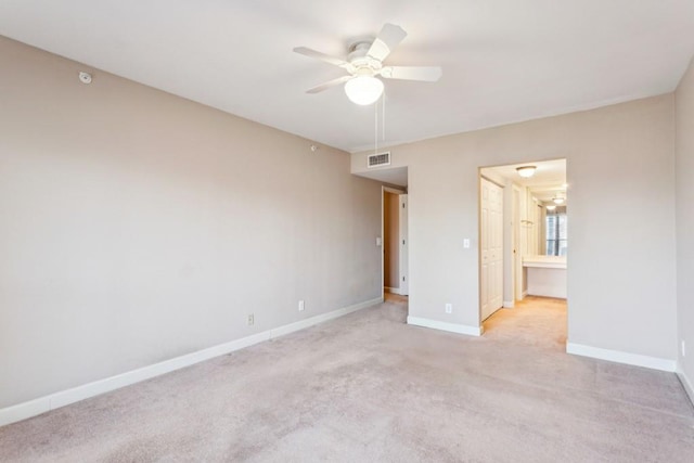 unfurnished bedroom with light colored carpet and ceiling fan