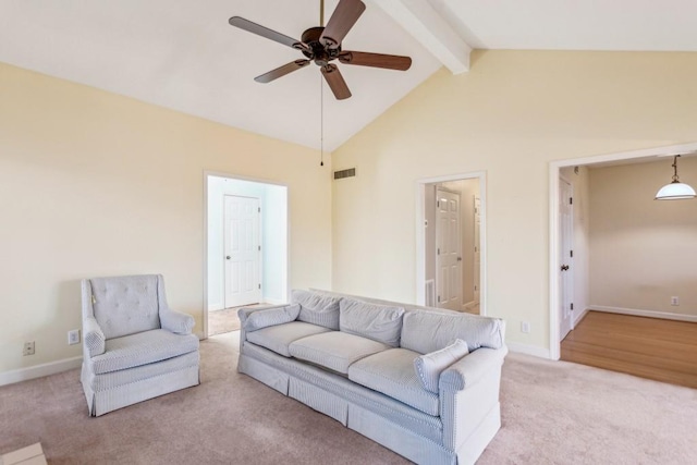living room with high vaulted ceiling, beam ceiling, light colored carpet, and ceiling fan