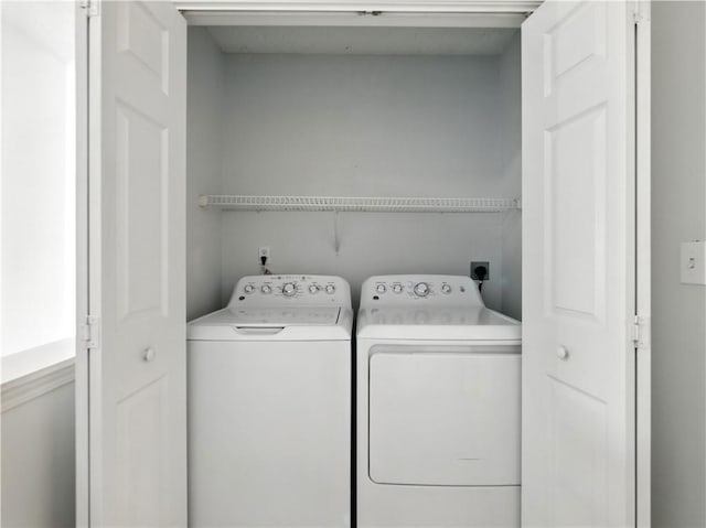 laundry room featuring laundry area and washing machine and clothes dryer