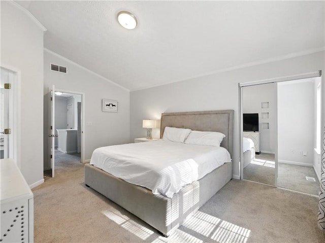 bedroom featuring carpet floors, crown molding, visible vents, vaulted ceiling, and baseboards