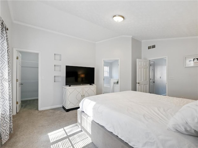 bedroom with baseboards, carpet, a walk in closet, vaulted ceiling, and crown molding