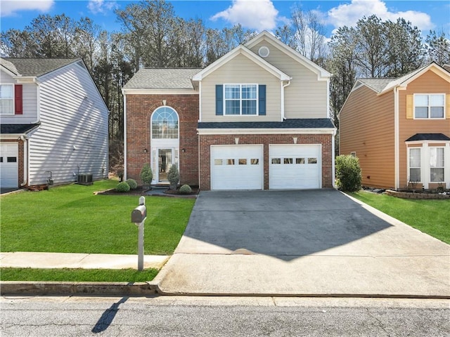 view of front of property featuring an attached garage, a front yard, concrete driveway, and brick siding