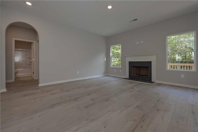 unfurnished living room with light wood-type flooring