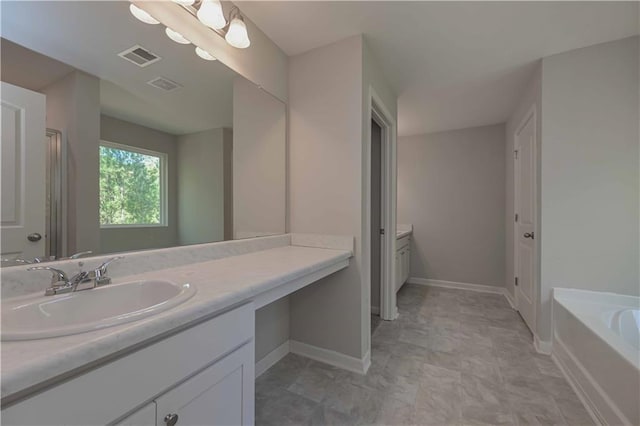 bathroom featuring vanity and a bathtub