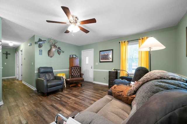 225 Hardin Rd SW, Plainville, GA 30733 - living area with wood finished floors, ceiling fan, baseboards, and a textured ceiling