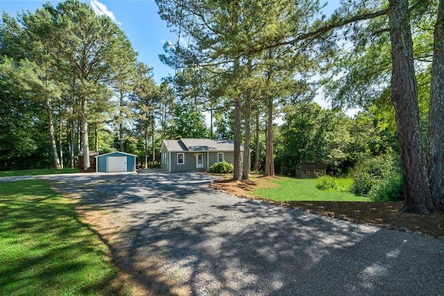 225 Hardin Rd SW, Plainville, GA 30733 - ranch-style house featuring gravel driveway, a garage, and a front lawn