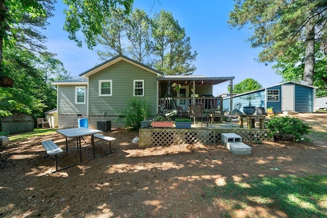 225 Hardin Rd SW, Plainville, GA 30733 - rear view of house featuring a wooden deck, crawl space, and a detached garage