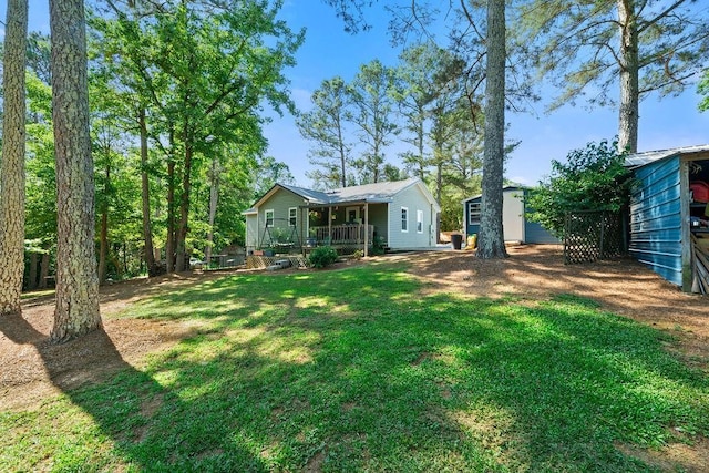 225 Hardin Rd SW, Plainville, GA 30733 - view of grassy yard featuring a deck