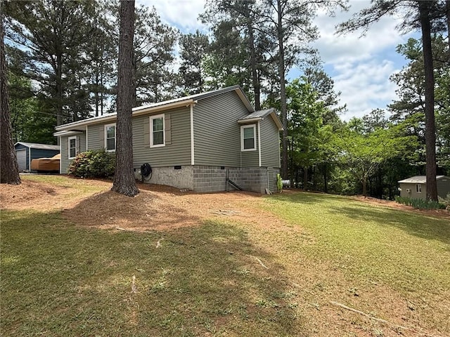 225 Hardin Rd SW, Plainville, GA 30733 - view of home's exterior featuring crawl space, a lawn, and view of scattered trees
