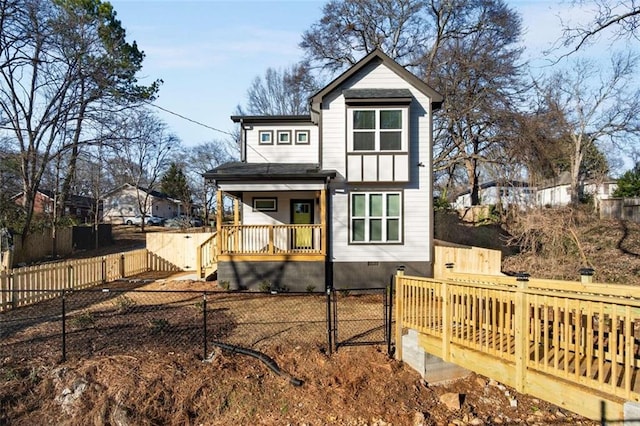 back of house featuring a porch