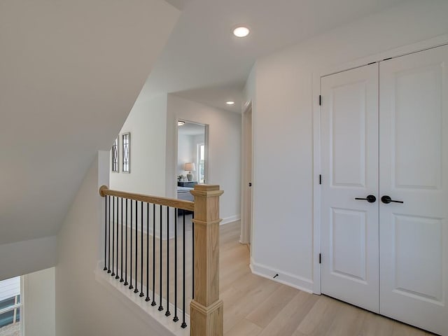 107 Winsome Way, Woodstock, GA 30188 - corridor with recessed lighting, baseboards, light wood-type flooring, and an upstairs landing