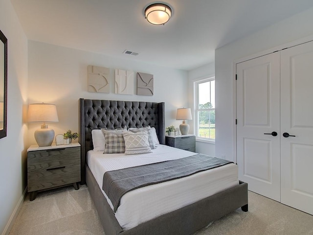 carpeted bedroom featuring a closet