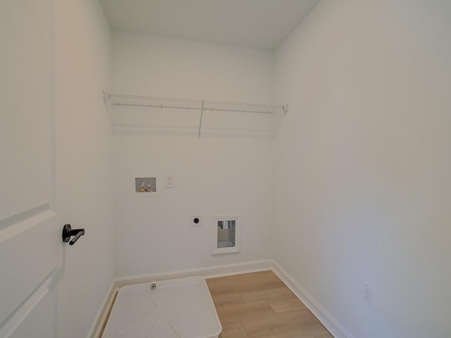 107 Winsome Way, Woodstock, GA 30188 - clothes washing area with laundry area, baseboards, light wood-style floors, electric dryer hookup, and washer hookup